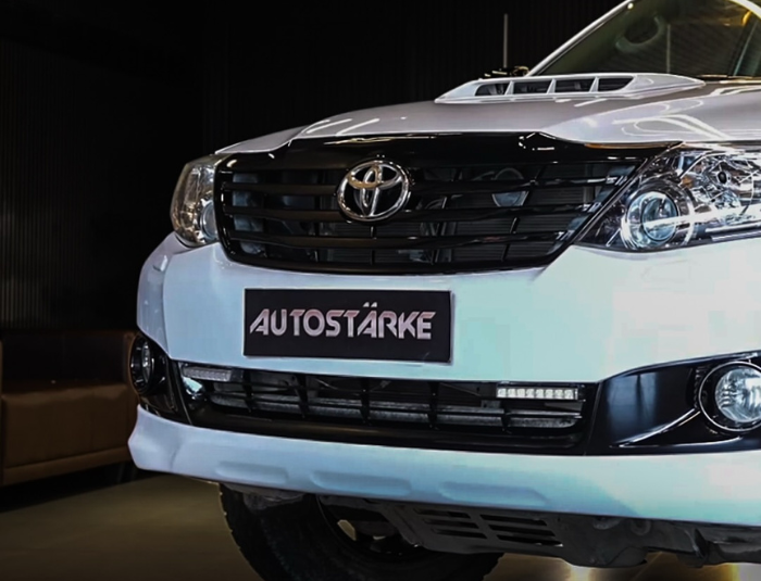 Toyota Fortuner with JDM white body paint and painted brake calipers by Autostarke in Kerala