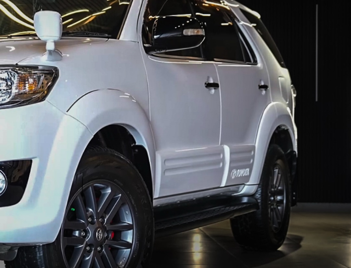 Toyota Fortuner custom white exterior paint and brake calipers by Autostarke in Kerala